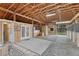 Spacious barn interior featuring wood construction, ample lighting, and stall areas for horses or livestock at 36700 Mossberg Ct, Elizabeth, CO 80107