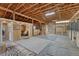Spacious horse barn interior with wooden stalls, ceiling beams, and ample space at 36700 Mossberg Ct, Elizabeth, CO 80107
