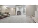 Open basement with sitting area, dining area, neutral walls and plush gray carpet at 36700 Mossberg Ct, Elizabeth, CO 80107