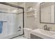 Clean bathroom featuring a shower with glass doors, a toilet, and a sink at 36700 Mossberg Ct, Elizabeth, CO 80107