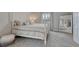 Inviting bedroom with a four-poster bed, soft carpet, and a large mirror at 36700 Mossberg Ct, Elizabeth, CO 80107