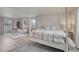 Bright bedroom featuring a four-poster bed, sitting area, and large windows at 36700 Mossberg Ct, Elizabeth, CO 80107