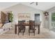 Comfortable dining area with hardwood floors, vaulted ceiling, and natural light at 36700 Mossberg Ct, Elizabeth, CO 80107