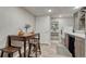 Laundry room with dining table, modern washer, and open shelving at 36700 Mossberg Ct, Elizabeth, CO 80107