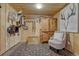 The living room features rustic decor, including a saddle and riding equipment and mounted deer antlers at 36700 Mossberg Ct, Elizabeth, CO 80107
