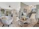 Open-concept living area with dining area, stairs to the second floor, and hardwood floors at 36700 Mossberg Ct, Elizabeth, CO 80107