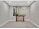 Neutral room featuring a decorative wooden console table and striking nature print at 36700 Mossberg Ct, Elizabeth, CO 80107