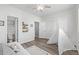 Bright bedroom featuring closet, luxury vinyl flooring, and an ensuite bathroom with vanity at 8199 Welby Rd # 1806, Denver, CO 80229