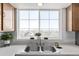 A modern kitchen sink and window combination, featuring a dual bowl sink, decor and a view to the outdoors at 8199 Welby Rd # 1806, Denver, CO 80229