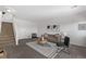 Cozy living room with neutral walls, carpet, staircase and modern furnishings at 8199 Welby Rd # 1806, Denver, CO 80229