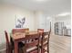 Cozy dining area with seating for four, hardwood floors and artwork at 6568 S Dahlia Cir, Centennial, CO 80121