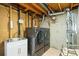 Efficient laundry room featuring new washer and dryer units, along with a utility sink for added convenience at 6568 S Dahlia Cir, Centennial, CO 80121
