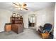 Well-lit office space with built-in desk and ample storage, plus a comfortable rocking chair at 6568 S Dahlia Cir, Centennial, CO 80121