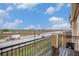 View from the balcony with black metal railings looking out to a highway and commercial buildings at 11250 Florence St # 29D, Commerce City, CO 80640