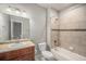 A well-lit bathroom with a tub/shower combo, white fixtures, and a vanity with a sink at 11250 Florence St # 29D, Commerce City, CO 80640