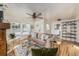 Spacious living room with hardwood floors and a view into the kitchen at 7121 W 52Nd Ave, Arvada, CO 80002