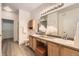 Well-lit bathroom features double sinks, wooden cabinets, and a separate shower at 4221 S Blackhawk Cir # 7G, Aurora, CO 80014