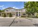 Exterior of home featuring stone facade, well-maintained landscaping and attached garages at 4221 S Blackhawk Cir # 7G, Aurora, CO 80014