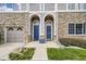 Charming townhouse facade with stone accents, arched entryways, and well-maintained landscaping at 4221 S Blackhawk Cir # 7G, Aurora, CO 80014