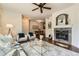 Inviting living room featuring a cozy fireplace, stylish decor, and comfortable seating at 4221 S Blackhawk Cir # 7G, Aurora, CO 80014