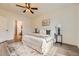 Bright main bedroom with a ceiling fan, modern decor, and an ensuite bathroom at 4221 S Blackhawk Cir # 7G, Aurora, CO 80014