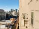 Balcony view showcasing the cityscape with classic architectural details and a decorative urn at 475 W 12Th Ave # 9A, Denver, CO 80204