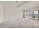 Spacious bedroom featuring neutral carpet, shuttered windows, and abundant natural light at 475 W 12Th Ave # 9A, Denver, CO 80204