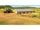 Aerial view of expansive property with barn and land at 1641 Castlewood Dr, Franktown, CO 80116