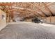 Large barn interior with ample space for vehicles and equipment at 1641 Castlewood Dr, Franktown, CO 80116