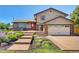 Two story home with landscaped yard and attached garage at 1641 Castlewood Dr, Franktown, CO 80116