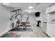 Basement home gym with various equipment and flooring at 1641 Castlewood Dr, Franktown, CO 80116