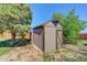 Yard with storage shed and mature trees at 1641 Castlewood Dr, Franktown, CO 80116