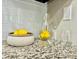 Close-up of granite countertop with yellow lemons at 9680 Brentwood Way # 203, Broomfield, CO 80021