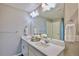 Clean bathroom with double sinks and decorative flowers on the vanity at 17341 Red Cosmos Pt, Parker, CO 80134