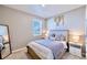 Cozy bedroom with neutral decor, comfortable bedding, and a bright window at 17341 Red Cosmos Pt, Parker, CO 80134