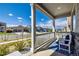 Inviting covered front porch with a white railing and seating area, perfect for relaxing outdoors at 17341 Red Cosmos Pt, Parker, CO 80134