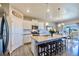 Modern kitchen with a large island, stainless steel appliances, and plenty of natural light at 17341 Red Cosmos Pt, Parker, CO 80134