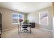 Bright office space with a large window, desk, chair, and modern decor at 17341 Red Cosmos Pt, Parker, CO 80134