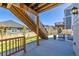 Outdoor patio area with seating and stairs leading to the deck at 17341 Red Cosmos Pt, Parker, CO 80134