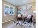 Cozy sitting room featuring neutral walls, with two armchairs and stylish decor at 17341 Red Cosmos Pt, Parker, CO 80134