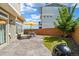 Backyard featuring a patio with an outdoor dining table and a grill at 18372 E 100Th Pl, Commerce City, CO 80022