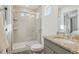 Bathroom featuring a glass-enclosed shower, granite countertop, and modern fixtures at 18372 E 100Th Pl, Commerce City, CO 80022