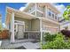 Inviting covered front porch with stone accents and manicured landscaping creating a warm welcome at 18372 E 100Th Pl, Commerce City, CO 80022