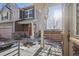 Charming covered front porch with stone accents and plenty of natural light at 18372 E 100Th Pl, Commerce City, CO 80022