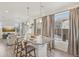 Bright, open kitchen with stainless steel appliances, granite countertops, and breakfast bar at 18372 E 100Th Pl, Commerce City, CO 80022