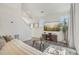 Open-concept living room with hardwood floors, neutral decor, and modern furnishings at 18372 E 100Th Pl, Commerce City, CO 80022