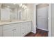 Double vanity bathroom with white cabinets and a shower at 461 Interlocken Blvd # 102, Broomfield, CO 80021