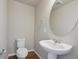 Clean bathroom with white vanity and a large mirror at 461 Interlocken Blvd # 102, Broomfield, CO 80021