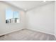 Simple bedroom with carpet and a window offering natural light at 461 Interlocken Blvd # 102, Broomfield, CO 80021