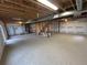 Unfinished basement with exposed ceiling, carpeting, and visible utilities, ready for customization and added living space at 3223 Castle Peak Ave, Superior, CO 80027